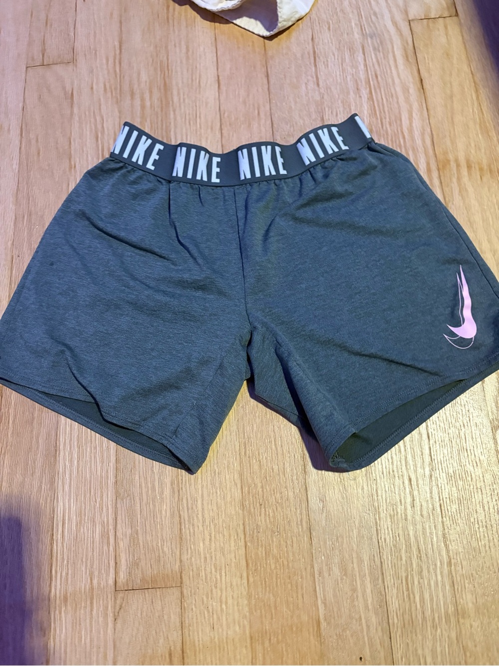 Nike Women's Dark Gray Athletic Shorts with Pink Swoosh and Branded Waistband